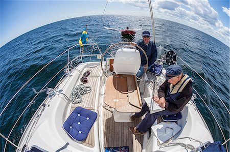 swedish flag - Senior men on boat Stockbilder - Premium RF Lizenzfrei, Bildnummer: 6102-08747110