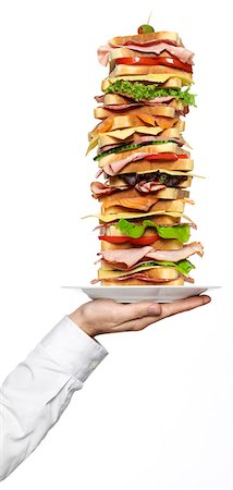 Person holding stack of sandwiches Foto de stock - Sin royalties Premium, Código: 6102-08748465