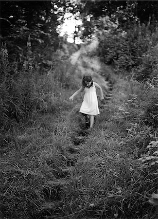 simsearch:6102-05655443,k - Girl walking down steps in forest Stock Photo - Premium Royalty-Free, Code: 6102-08748478