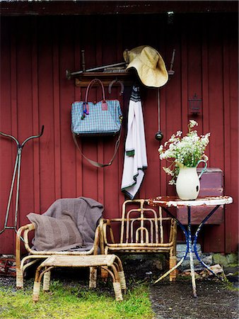 simsearch:6102-06470764,k - Scandinavia, Sweden, Stockholm, View of gardening tools and wicker furniture outside house Stock Photo - Premium Royalty-Free, Code: 6102-08748428