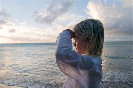 A Scandinavian girl standing by the sea, Guadeloupe. Stock Photo - Premium Royalty-Free, Code: 6102-08748750