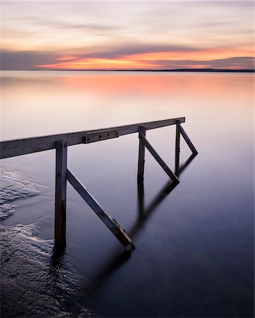 simsearch:6102-08748869,k - Handrail on beach at sunset Stock Photo - Premium Royalty-Free, Code: 6102-08760280