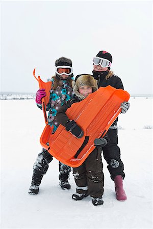 simsearch:6102-03905124,k - Children with broken toboggan Stock Photo - Premium Royalty-Free, Code: 6102-08760381