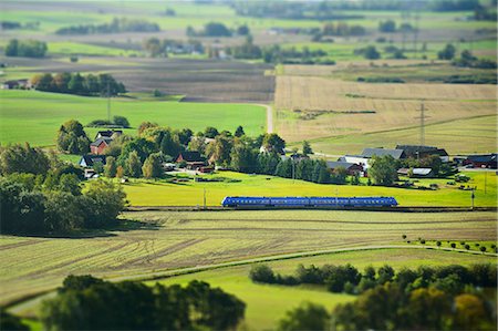 simsearch:6102-08520618,k - Aerial view of landscape with train passing Stock Photo - Premium Royalty-Free, Code: 6102-08760465