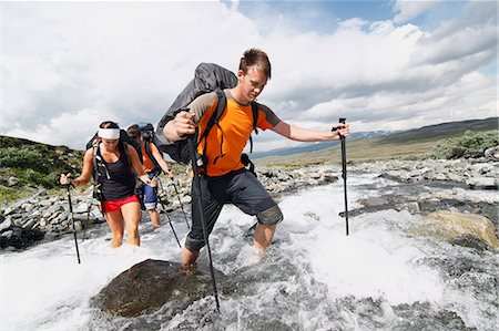 simsearch:632-05553953,k - Hikers crossing mountain river Stock Photo - Premium Royalty-Free, Code: 6102-08760401