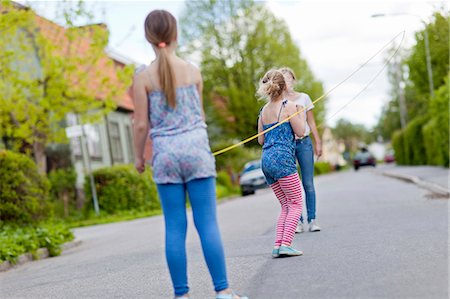 Two girl standing, rear view Stock Photo - Premium Royalty-Free, Code: 6102-08760571