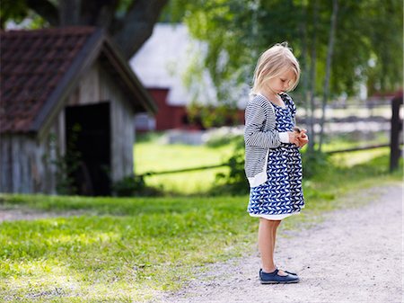 feathers europe - Girl on graveled road Stock Photo - Premium Royalty-Free, Code: 6102-08760780