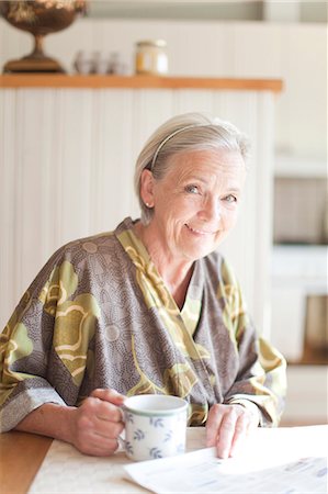 senior woman newspaper - Senior woman in morning Stock Photo - Premium Royalty-Free, Code: 6102-08761043