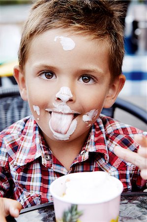 sticky - Boy eating ice-cream, Stockholm, Sweden Stock Photo - Premium Royalty-Free, Code: 6102-08761082