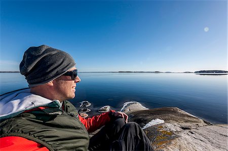 simsearch:6102-08748869,k - Man resting at sea, Sweden Stock Photo - Premium Royalty-Free, Code: 6102-08761192