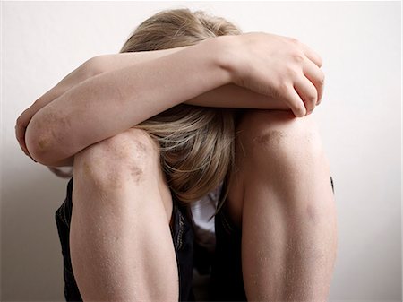 sad picture of a teenage boy alone - Boy looking down Stock Photo - Premium Royalty-Free, Code: 6102-08761392