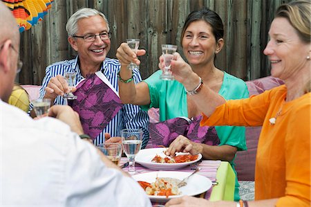 simsearch:6102-07602991,k - People drinking at crayfish party, Sweden Fotografie stock - Premium Royalty-Free, Codice: 6102-08761307