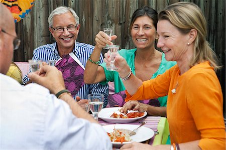 simsearch:6102-07602991,k - People drinking at crayfish party, Sweden Fotografie stock - Premium Royalty-Free, Codice: 6102-08761306