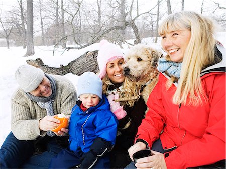 family dog grandparents parents child - A family on a winter picnic. Stock Photo - Premium Royalty-Free, Code: 6102-08761664
