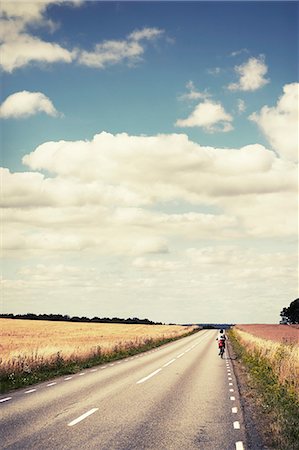 Parent cycling with child Stock Photo - Premium Royalty-Free, Code: 6102-08761613