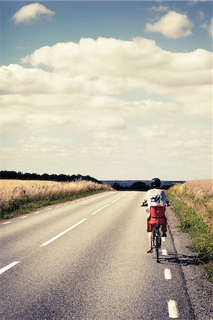 Parent cycling with child Stock Photo - Premium Royalty-Free, Code: 6102-08761615