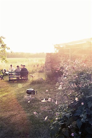 european cottage gardens - Family having meal in garden Stock Photo - Premium Royalty-Free, Code: 6102-08761620