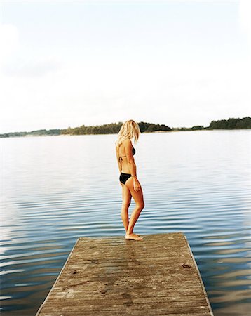 simsearch:6102-08063042,k - A woman on a jetty. Stock Photo - Premium Royalty-Free, Code: 6102-08768689