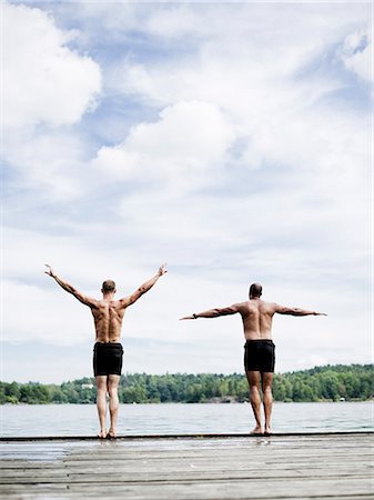 scandinavia lake friends - Two men on a jetty, Sweden. Foto de stock - Sin royalties Premium, Código: 6102-08768777