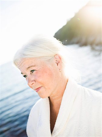 simsearch:6102-08566169,k - Portrait of a senior woman by the sea. Stock Photo - Premium Royalty-Free, Code: 6102-08768701