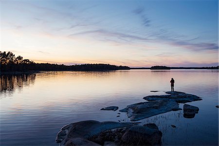 dark sky - Silhouette of person at water Stock Photo - Premium Royalty-Free, Code: 6102-08726874