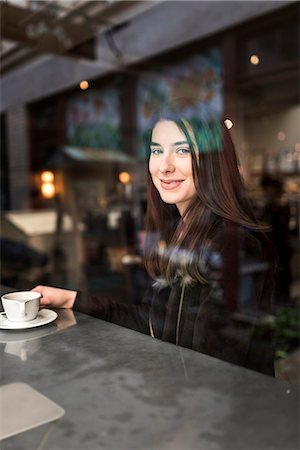 expresso - Smiling woman in cafe Stock Photo - Premium Royalty-Free, Code: 6102-08726831