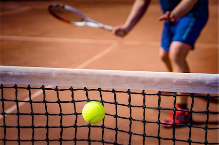 playing tennis middle age - Playing tennis Stock Photo - Premium Royalty-Free, Code: 6102-08726946