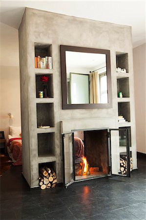 simsearch:6102-08726973,k - Fireplace in modern interior Foto de stock - Sin royalties Premium, Código: 6102-08726972