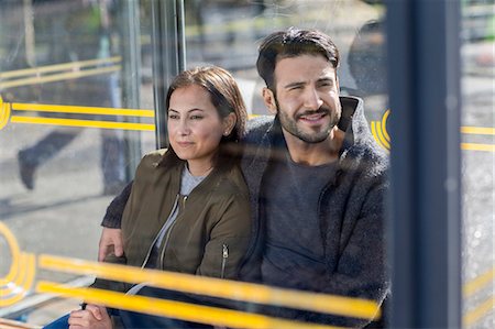 sitting at bus stop - Couple waiting on bus stop Stock Photo - Premium Royalty-Free, Code: 6102-08727030