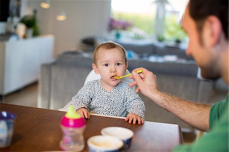 simsearch:6102-08858419,k - Father feeding daughter Stock Photo - Premium Royalty-Free, Code: 6102-08858481