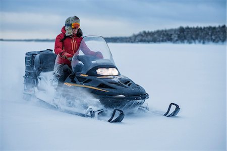 snow forest dusk - Person on snowmobile Stock Photo - Premium Royalty-Free, Code: 6102-08858410