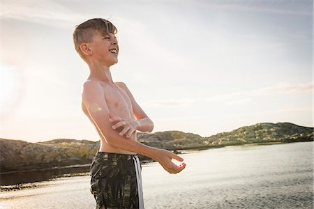 single boy - Happy boy at sea Stock Photo - Premium Royalty-Free, Code: 6102-08858672