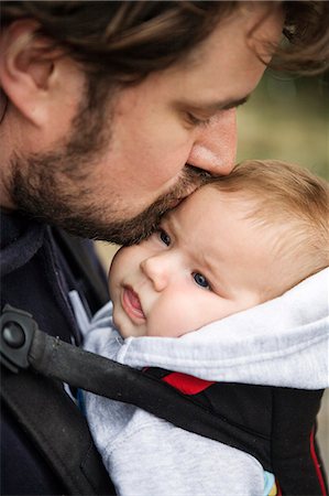 simsearch:6102-08858419,k - Father kissing baby Stock Photo - Premium Royalty-Free, Code: 6102-08858605