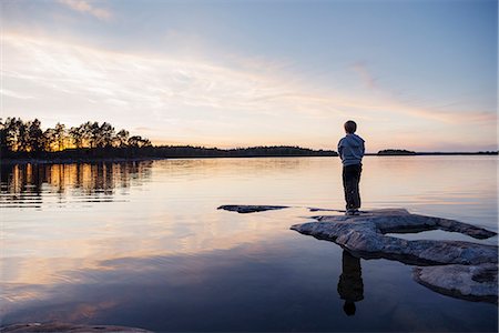 Boy at water Stock Photo - Premium Royalty-Free, Code: 6102-08881472