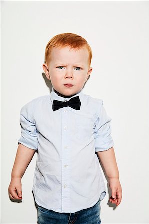 simsearch:6102-07521612,k - Portrait of toddler wearing bow tie Foto de stock - Sin royalties Premium, Código: 6102-08881730