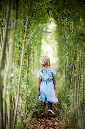 pergola and plant - Girl walking in bamboo grove Stock Photo - Premium Royalty-Free, Code: 6102-08881844