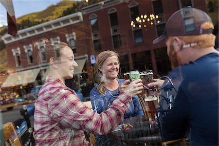 Friends having toast in bar Stock Photo - Premium Royalty-Free, Code: 6102-08881891