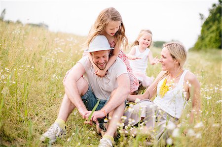 simsearch:6102-08885673,k - Family in meadow Stock Photo - Premium Royalty-Free, Code: 6102-08881823