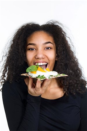 Teenage girl eating cake Foto de stock - Sin royalties Premium, Código: 6102-08881922