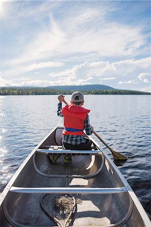 Boy kayaking Stock Photo - Premium Royalty-Free, Code: 6102-08885233