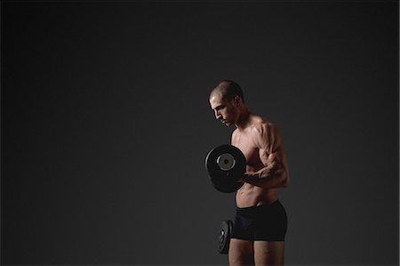 simsearch:6102-08995506,k - Man with dumbbells Stock Photo - Premium Royalty-Free, Code: 6102-08885403