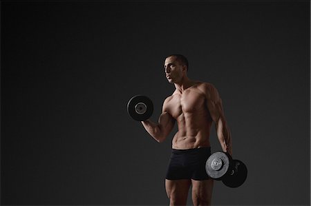 simsearch:6102-08995506,k - Man with dumbbells Stock Photo - Premium Royalty-Free, Code: 6102-08885405