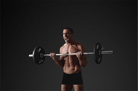simsearch:6102-08995506,k - Man with barbell Stock Photo - Premium Royalty-Free, Code: 6102-08885408