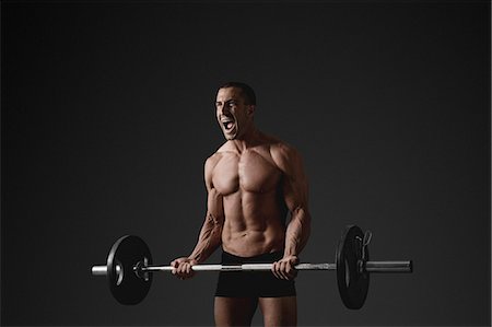 simsearch:6102-08995506,k - Man with barbell Stock Photo - Premium Royalty-Free, Code: 6102-08885409