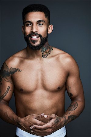 portrait tattoos for men - Portrait of mid-adult man Foto de stock - Sin royalties Premium, Código: 6102-08885769