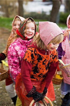 simsearch:6102-07282667,k - Sweden, Stockholm, three girls  in Easter costumes, outdoors Stock Photo - Premium Royalty-Free, Code: 6102-08800107