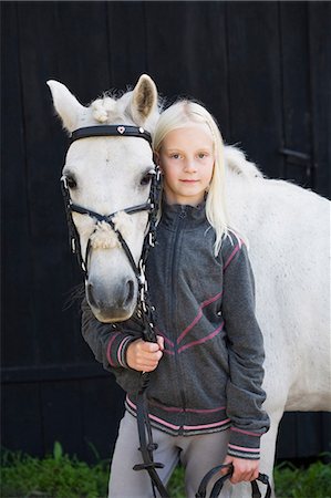 simsearch:6102-08746672,k - Portrait of girl with horse Photographie de stock - Premium Libres de Droits, Code: 6102-08800220