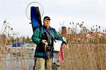 simsearch:6102-03867416,k - A senior man fishing, Sweden. Stock Photo - Premium Royalty-Free, Code: 6102-08800494