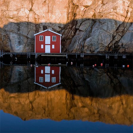simsearch:6102-07769211,k - A house by a cliff-face, Sweden. Stock Photo - Premium Royalty-Free, Code: 6102-08800560