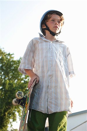 simsearch:6102-08942535,k - Boy with a skateboard, Sweden. Stock Photo - Premium Royalty-Free, Code: 6102-08800666